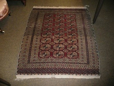 Lot 739 - A red and blue ground Tekke rug, 140cm by 121cm