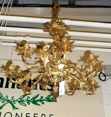 Lot 748 - A decorative gilt metal twelve branch chandelier