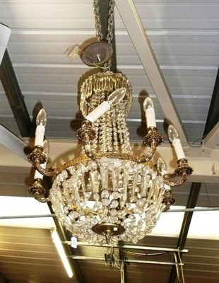 Lot 749 - Gilt metal eight branch chandelier with glass drops