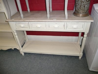 Lot 762 - A cream painted sideboard