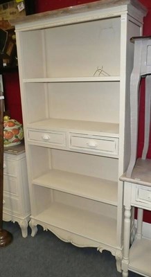 Lot 764 - A cream painted bookcase