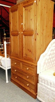 Lot 777 - Pine tall boy, pine mirror and pedestal bedside cabinet