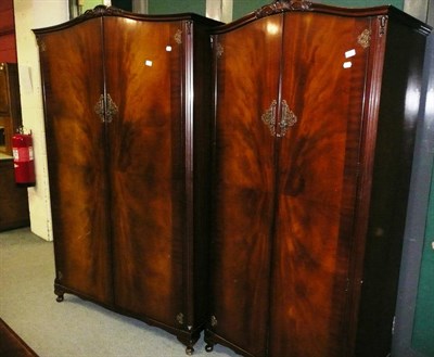 Lot 882 - N Norman Ltd of London, ladies and gents reproduction mahogany double door wardrobes (2)