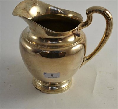 Lot 9 - A Sterling silver jug