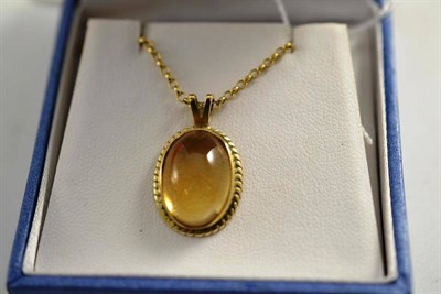 Lot 72 - A 9ct gold cabochon pendant on a 9ct gold chain