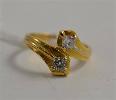 Lot 87 - A diamond two stone crossover ring