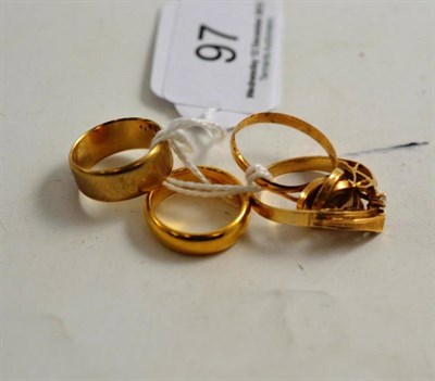 Lot 97 - A 22ct gold band ring, a 9ct gold band ring and two other rings