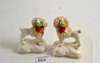 Lot 109 - Pair of 19th century spaniels carrying baskets