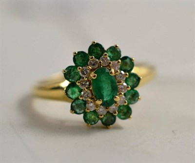 Lot 149 - A 9ct gold emerald and diamond cluster ring