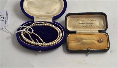 Lot 151 - A strand of small pearls and a pearl pin