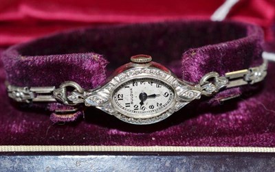 Lot 164 - A lady's diamond set wristwatch with case stamped '14k'