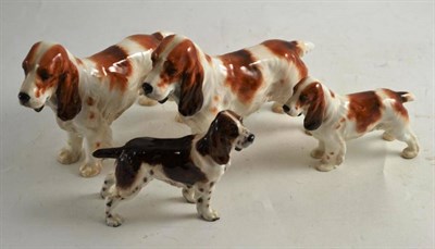 Lot 214 - Two large Royal Doulton retrievers and another two smaller (4)