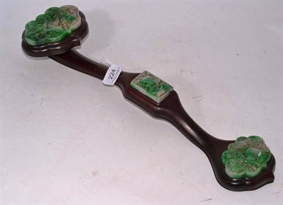 Lot 224 - A Chinese jade and hardwood ruyi sceptre in 18th Century Style, set with three shaped plaques...