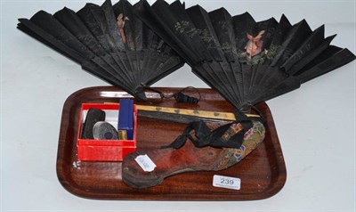 Lot 239 - Beaded slipper with leather sole, two ebonised fans with painted mounts, parasol handle, two silver