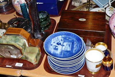 Lot 241 - Two trays including two Art Deco mantel clocks, Royal Copenhagen Christmas plates, rosewood...