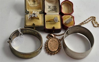 Lot 255 - Two 9ct gold dress rings, a silver bangle, a locket on chain, two other dress rings, etc