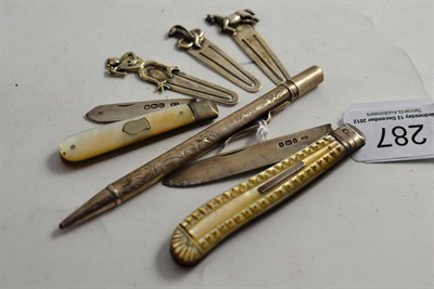 Lot 287 - Two silver fruit knives, silver pencil and three books marks, stamped '925'