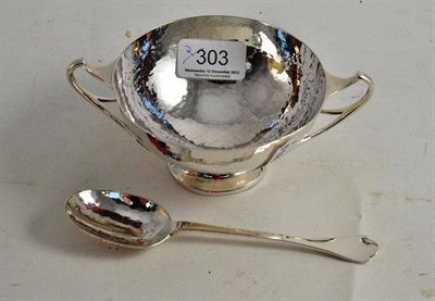 Lot 303 - A hammered silver two handled bowl and spoon