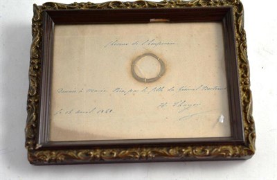 Lot 310 - A framed lock of hair, bearing a label reputedly belonging to a French Emperor dated 1848