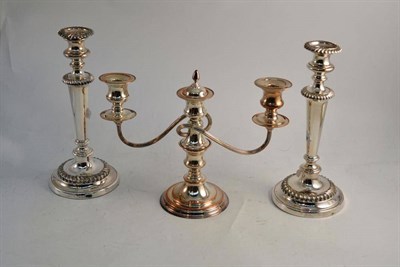 Lot 354 - A pair of plate on copper candlesticks and a two branch candelabra