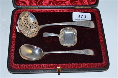 Lot 374 - Cased sifter spoon, caddy spoon and another cased