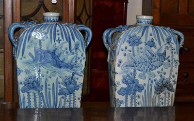 Lot 399 - A pair of large Chinese blue and white flasks decorated with fish