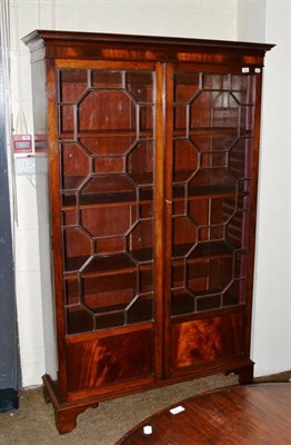 Lot 492 - A glazed mahogany bookcase