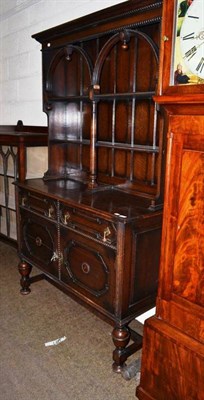 Lot 502 - A panelled oak dresser and rack