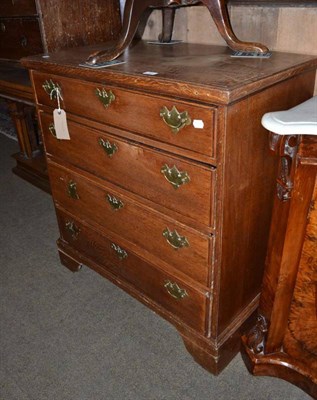 Lot 522 - A Georgian oak four height chest of drawers