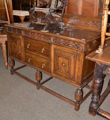 Lot 532 - A circa 1920s carved oak sideboard