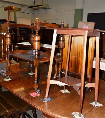 Lot 534 - An oak two tier trolley and a mahogany occasional table