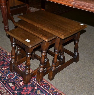 Lot 535 - An oak nest of tables