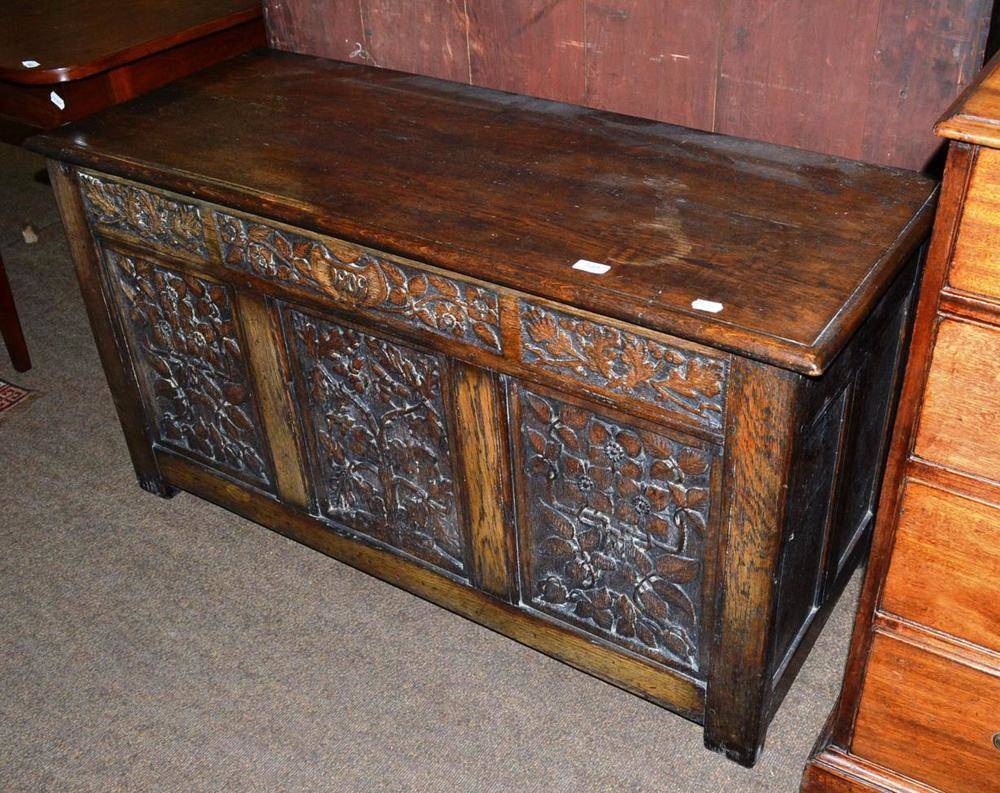 Lot 548 - Oak kist with carved decoration