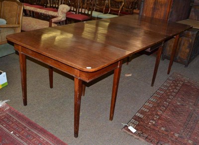 Lot 549 - Georgian mahogany drop leaf dining table