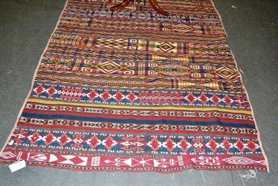 Lot 555 - An Uzbek flatweave, North Afghanistan, the field with polychrome bands of geometric motifs, 314...