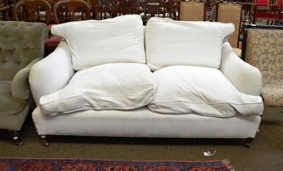 Lot 570 - A Victorian Howard style white upholstered sofa