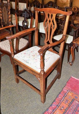 Lot 576 - A Georgian oak open armchair and a mahogany armchair