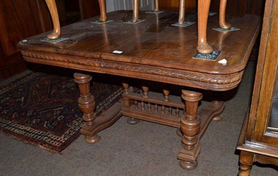 Lot 590 - A Continental walnut dining table