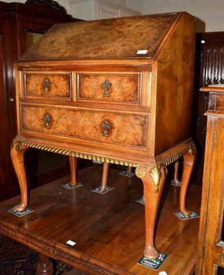 Lot 591 - A walnut bureau and matching chair