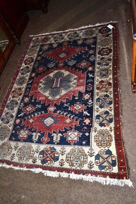 Lot 610 - An Afshar rug South East Persia, the indigo field of plants and flowers around three stepped...