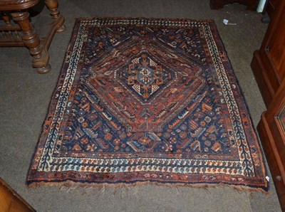 Lot 615 - Kashgai rug South West Persia, the deep indigo field of stylised plants and animals centred by...