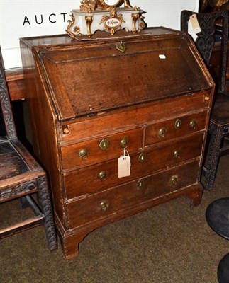 Lot 633 - A Georgian oak bureau