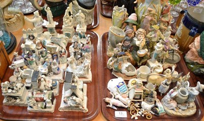 Lot 13 - A collection of bisque figures, Victorian china Fairings and miniature crested china (on two trays)