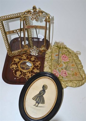 Lot 15 - Three Edwardian decorative brass photograph frames, a silhouette of 'Annie' and a silk petit...