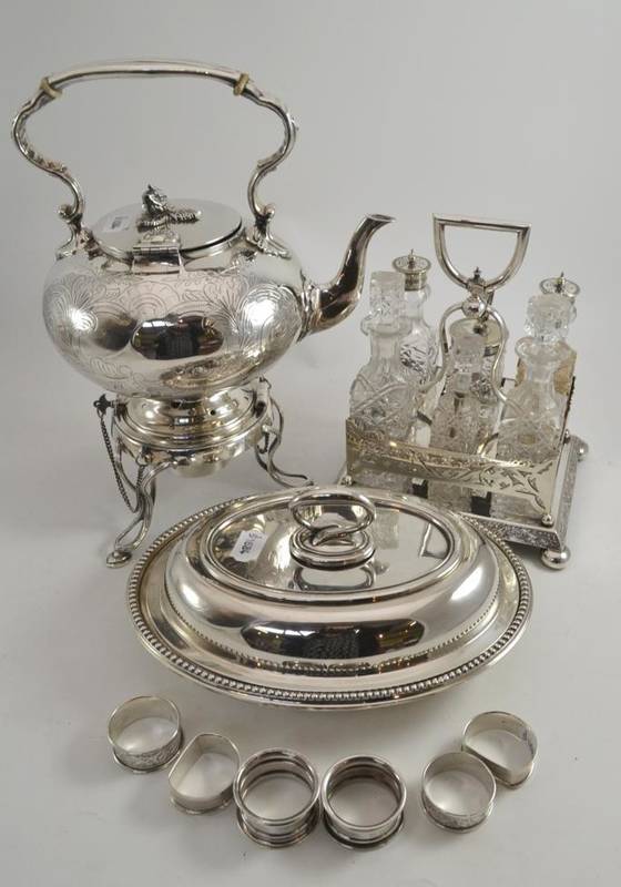 Lot 25 - Six silver napkin rings and silver plate including condiment stand, kettle on stand, entree...