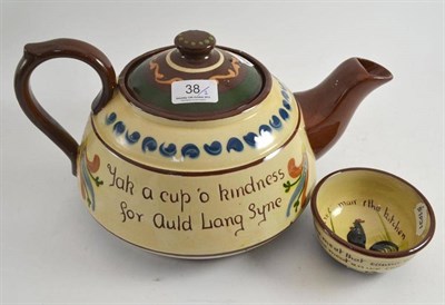 Lot 38 - A large Torquay pottery teapot and a sugar bowl