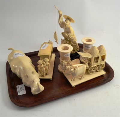 Lot 46 - A quantity of ivory including an ox cart group, a Chinese ivory fisherman, a rhino, sedan chair and