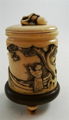 Lot 91 - A Japanese carved ivory small tusk section vase and cover, with ascetics in a cave circa, 1890-1900