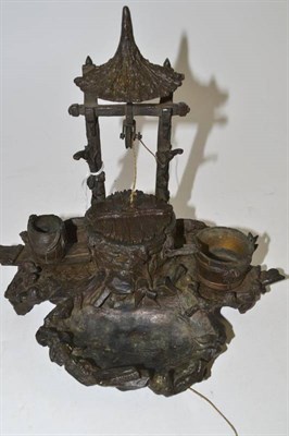 Lot 120 - A cast spelter novelty inkwell stand