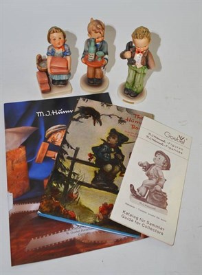 Lot 131 - Three Hummel china figure groups; The Builder, Waiter, Hello and three books